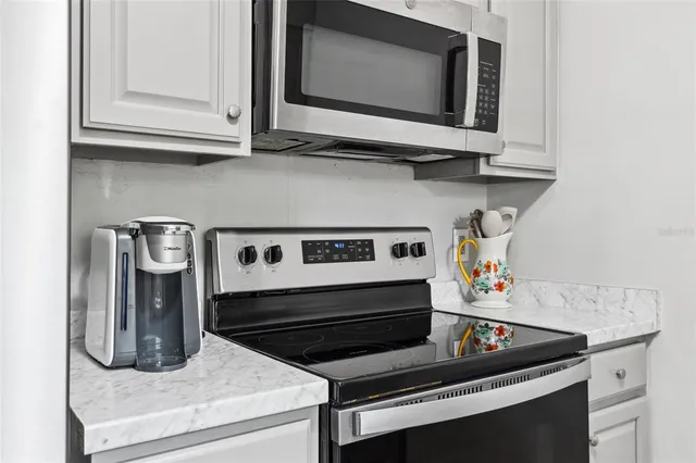 a kitchen with a stove and a microwave