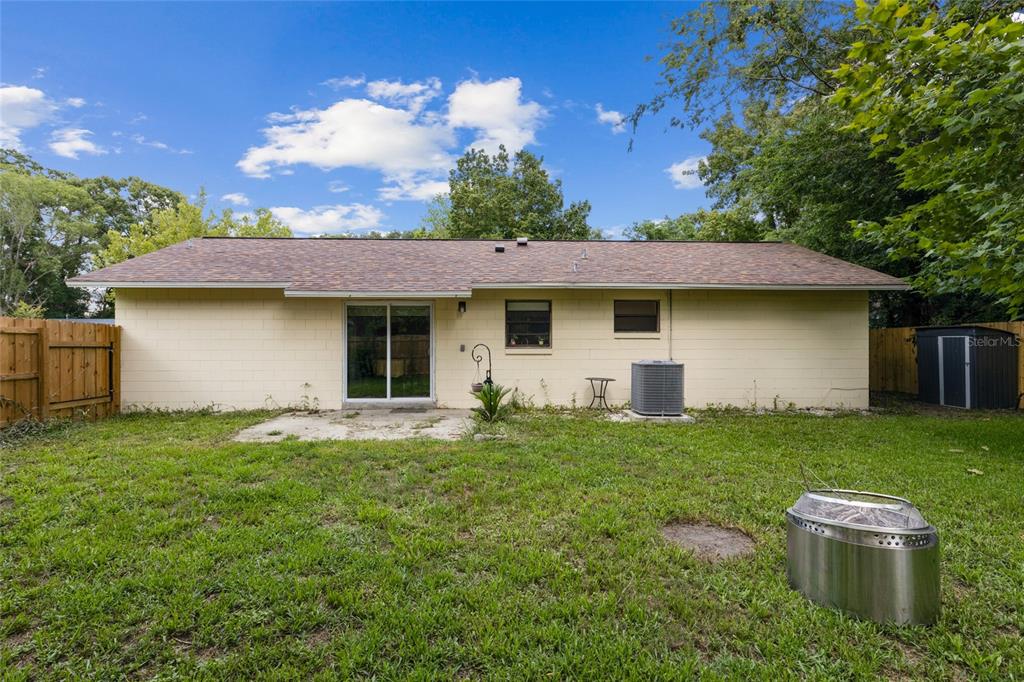 1228 Southwest 75th Drive Gainesville, FL 32607 - Photo 17 of 17 a view of a house with a yard