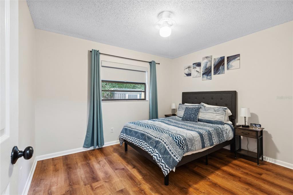 1228 Southwest 75th Drive Gainesville, FL 32607 - Photo 3 of 17 a bedroom with a bed and a window