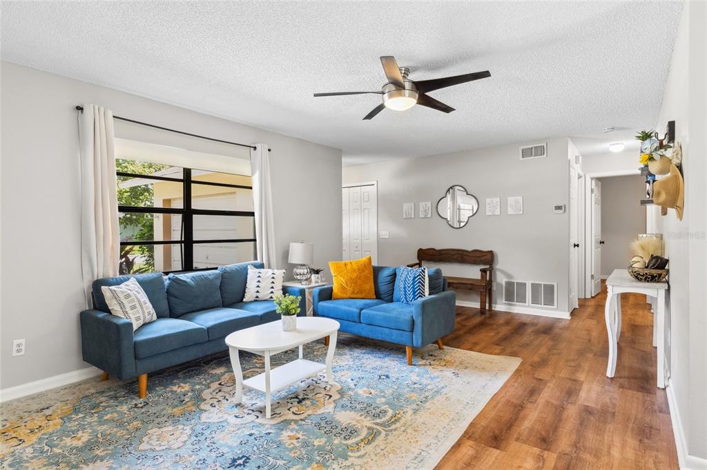 1228 Southwest 75th Drive Gainesville, FL 32607 - Photo 8 of 17 a living room with furniture and a window