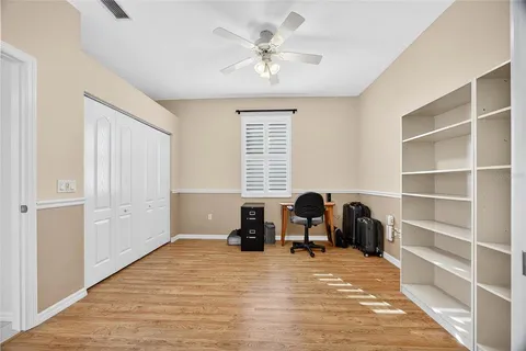 a view of a room with furniture and windows