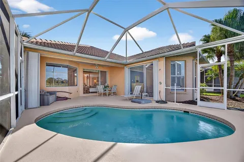 a view of a house with backyard porch and patio