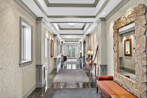 an aerial view of a house with garden space and street view