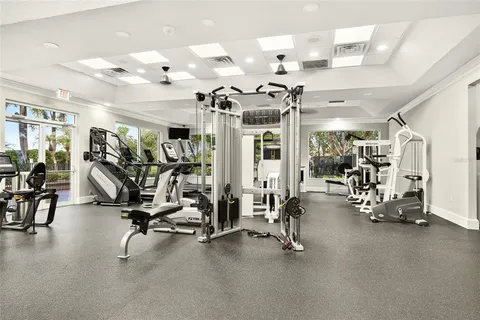 a view of a room with gym equipment and a large window