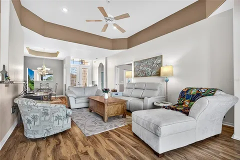 a living room with couches and painting on the wall