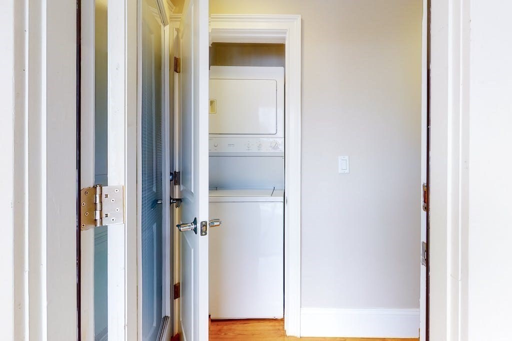 201 Pearl Street, Unit 2 Cambridge, MA 02139 - Photo 15 of 16 a view of a bathroom from a corridor