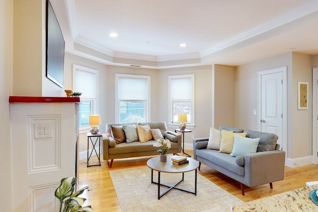 201 Pearl Street, Unit 2 Cambridge, MA 02139 - Photo 3 of 16 a living room with furniture and a fireplace
