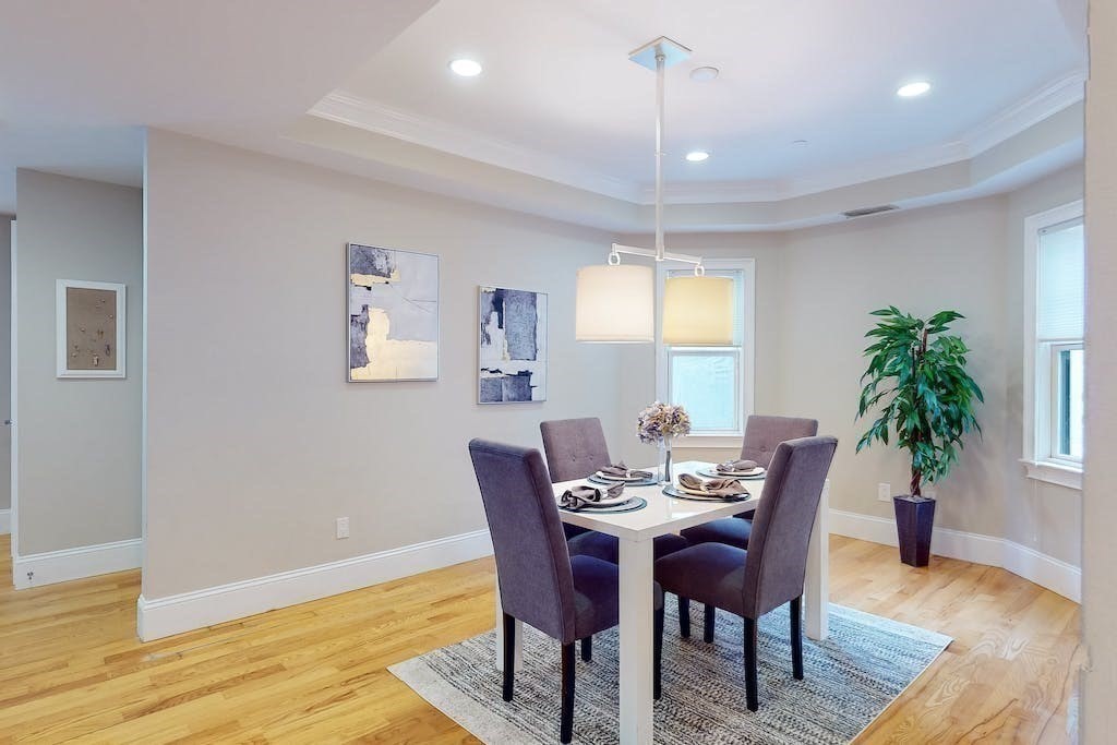 201 Pearl Street, Unit 2 Cambridge, MA 02139 - Photo 8 of 16 a view of a dining room with furniture window and wooden floor
