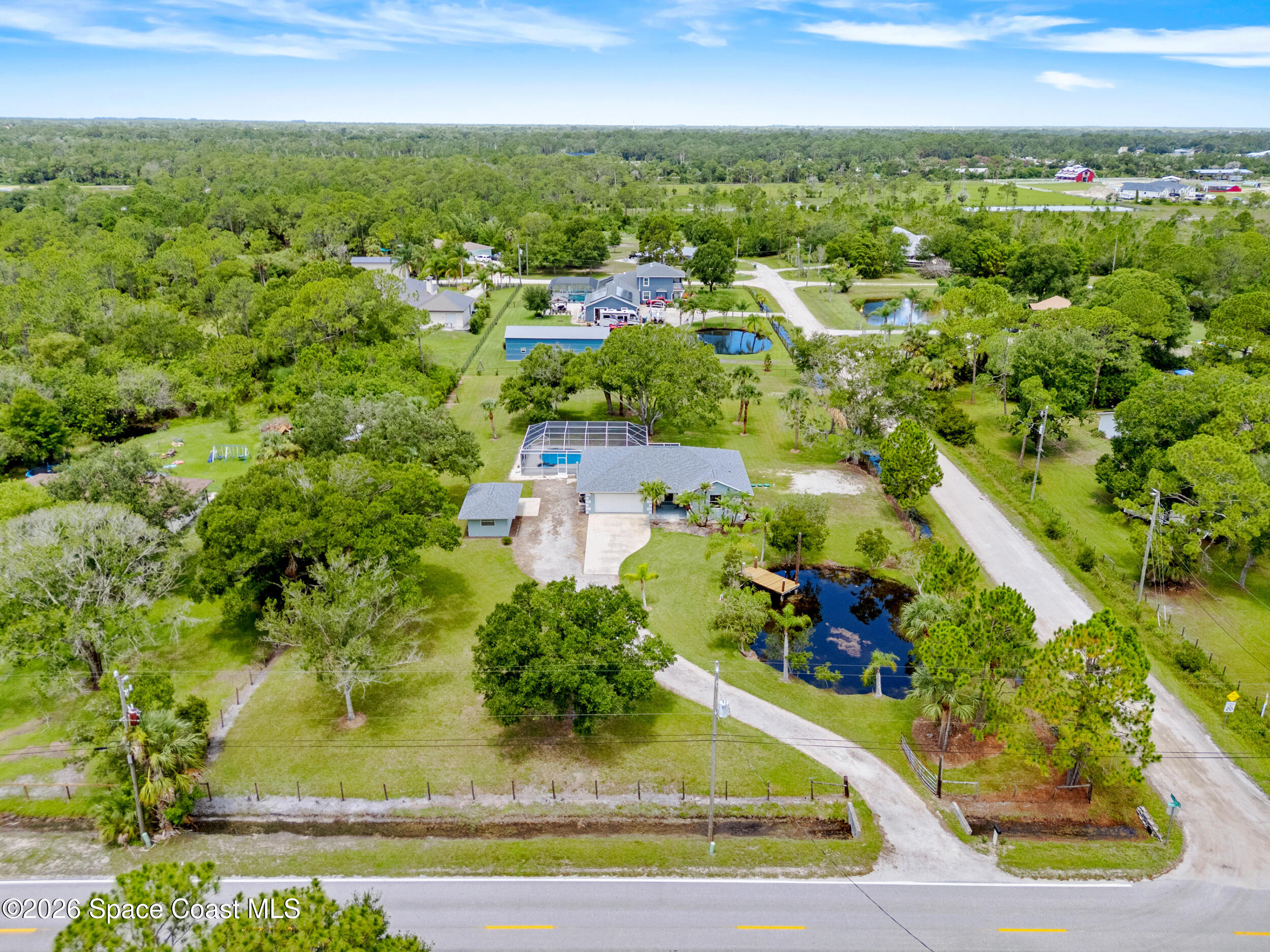 3480 Weber Road Malabar, FL 32950 - Photo 36 of 45 an aerial view of residential houses with outdoor space and trees