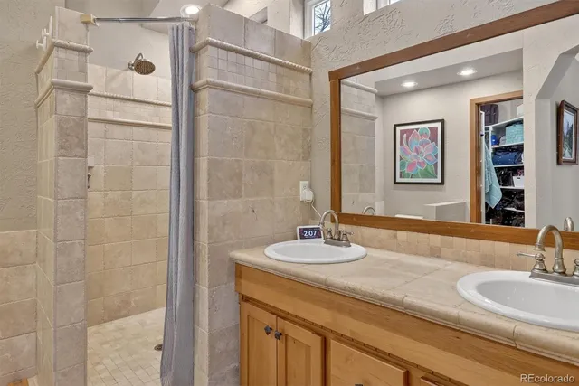 a bedroom with a bed and a table with chair