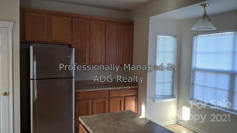 6336 Trotters Ridge Road Charlotte, NC 28227 - Photo 3 of 7 a kitchen with refrigerator and window