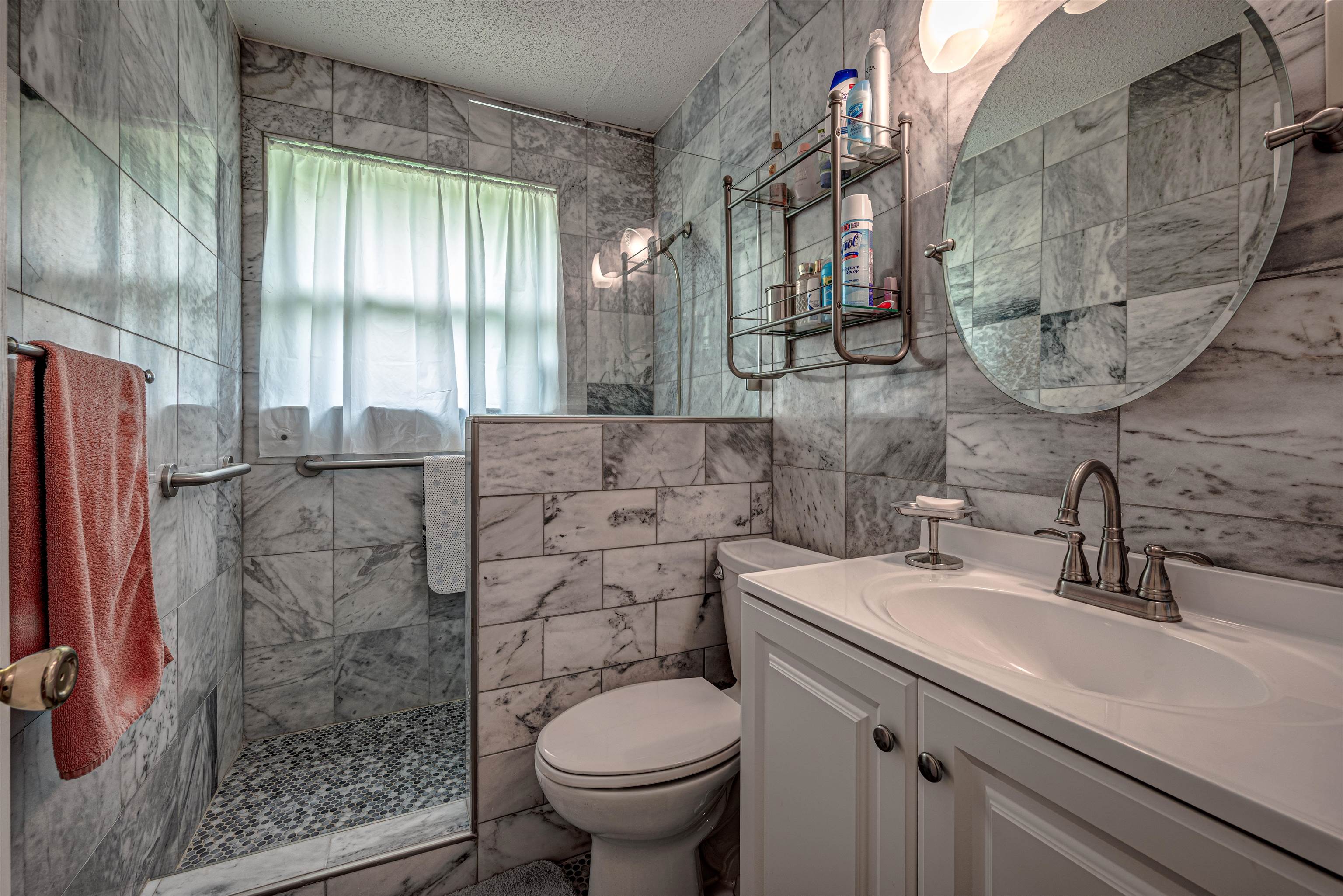 450 Malboro Road Memphis, TN 38120 - Photo 11 of 16 a bathroom with a sink and a mirror