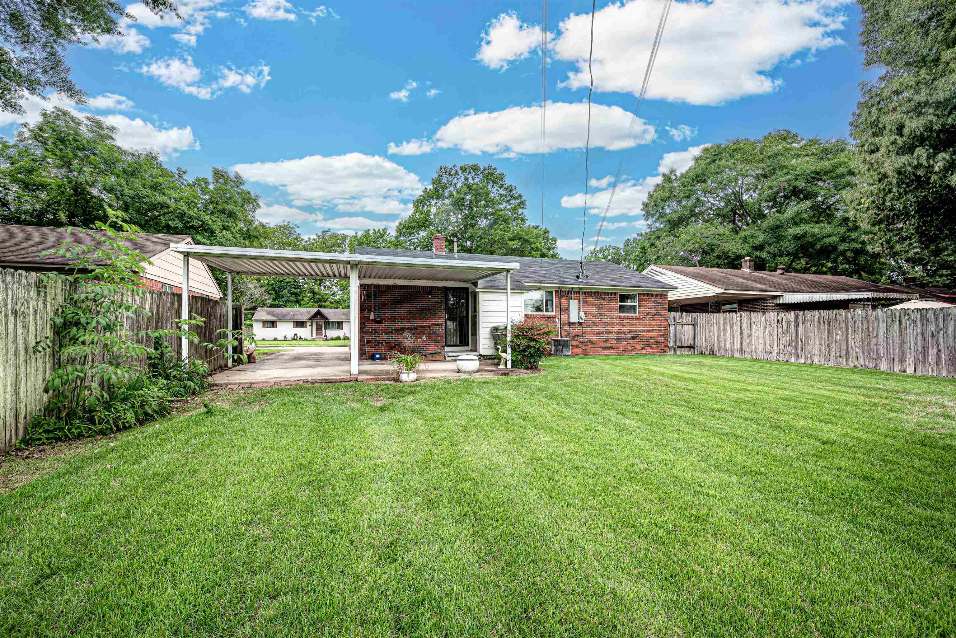 450 Malboro Road Memphis, TN 38120 - Photo 15 of 16 a view of a house with backyard porch and furniture
