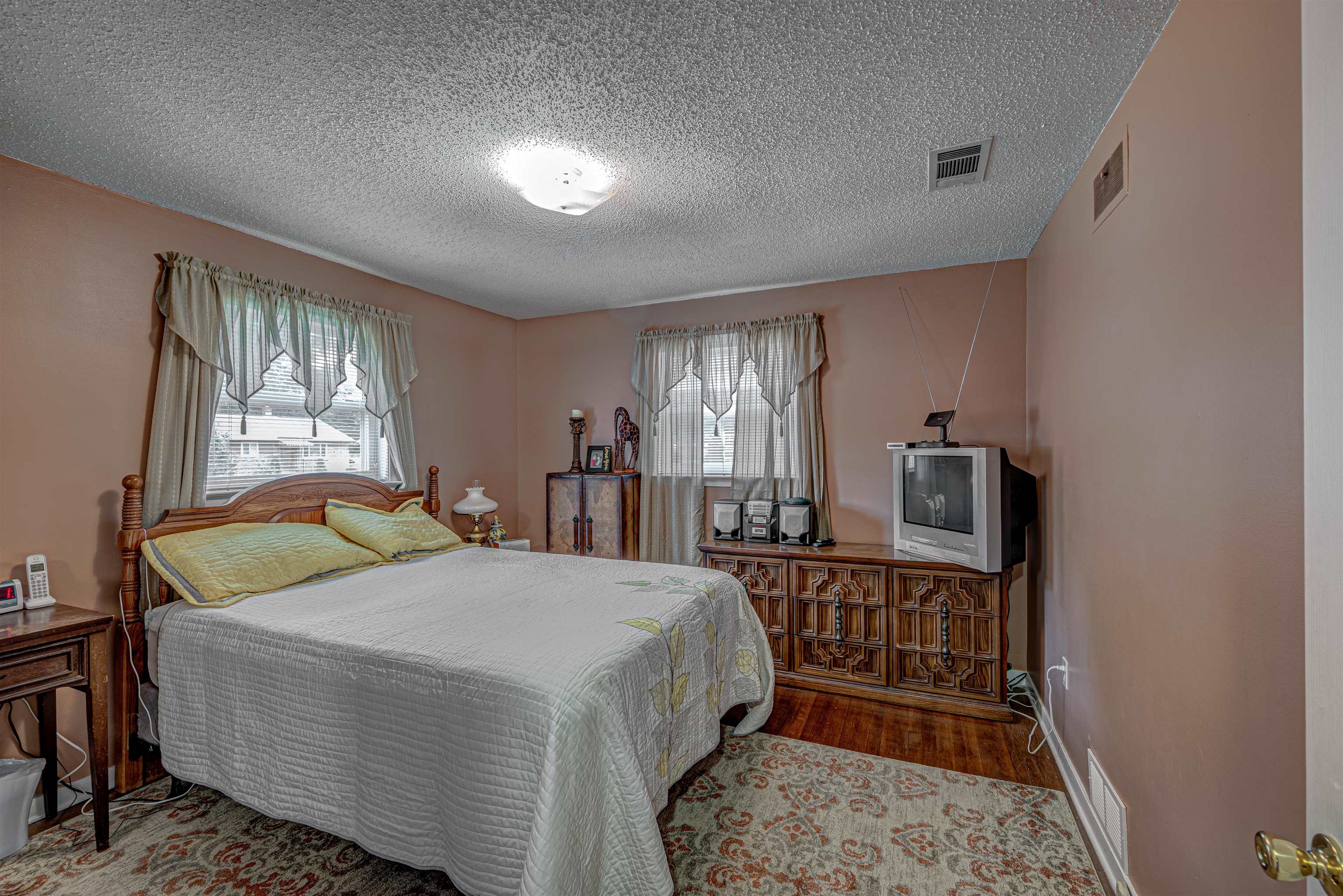 450 Malboro Road Memphis, TN 38120 - Photo 9 of 16 a bedroom with a bed a window and dresser