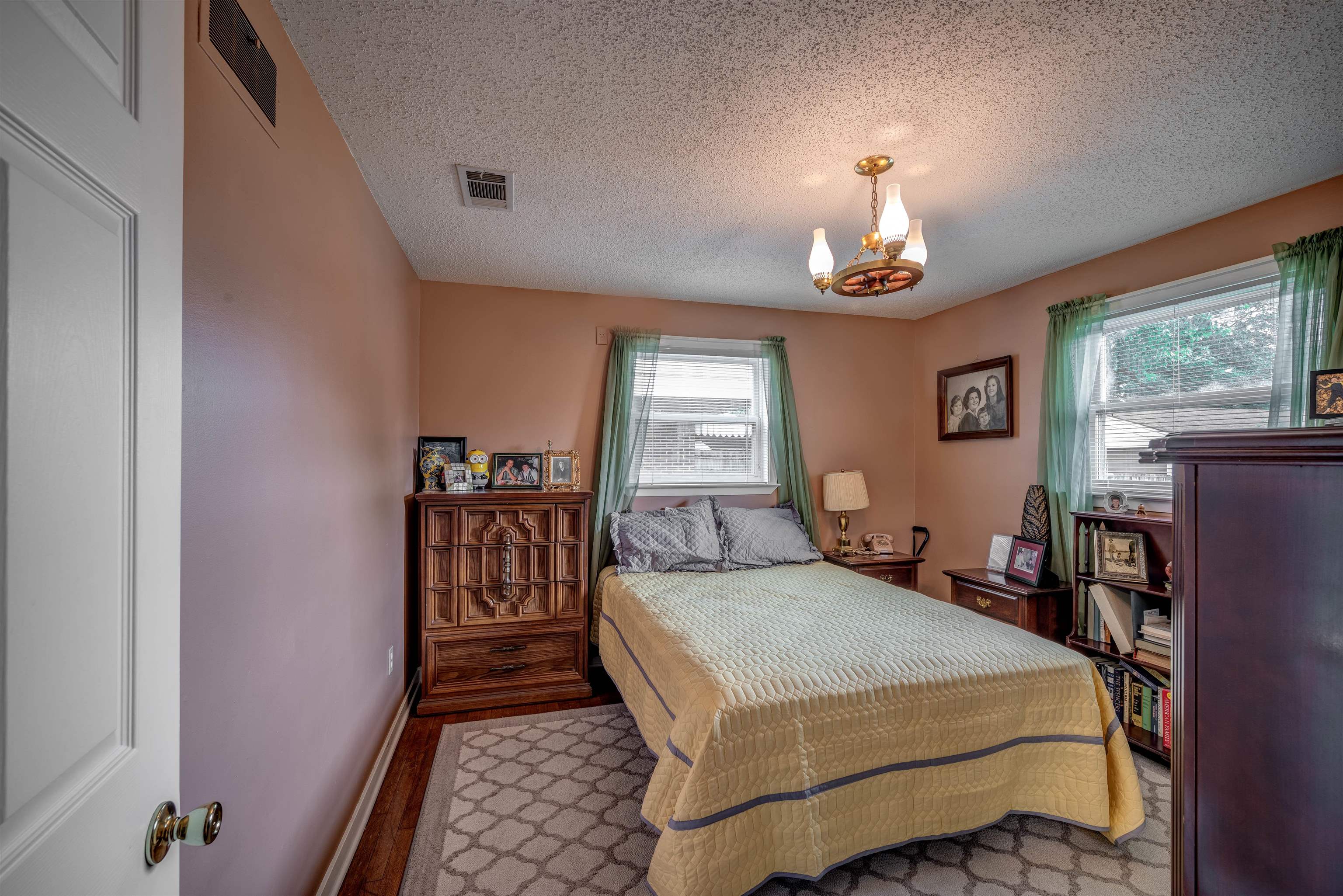 450 Malboro Road Memphis, TN 38120 - Photo 10 of 16 a bedroom with a bed and wooden floor