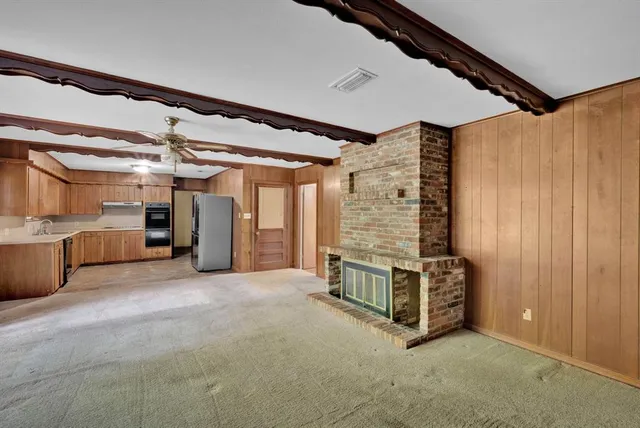 a view of a room with wooden walls