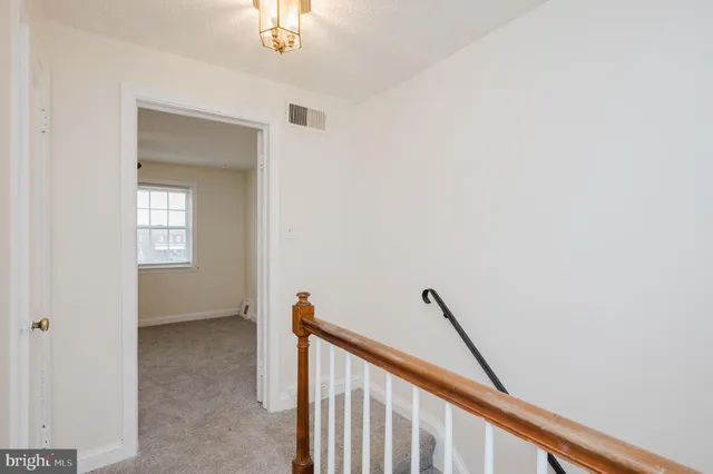a view of a hallway with entryway