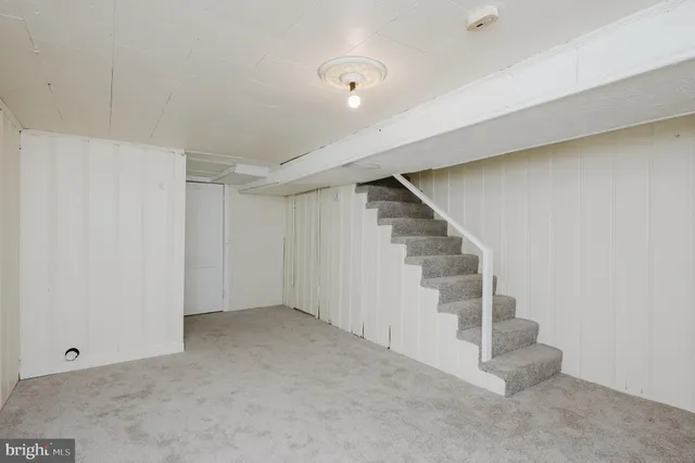 a view of an empty room with stairs