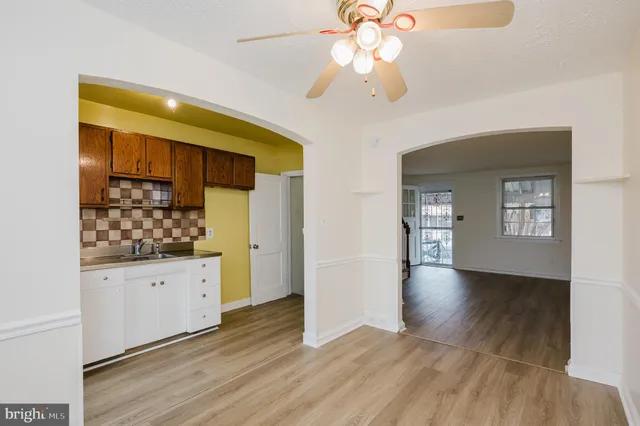 a view of a kitchen cabinets and wooden floor
