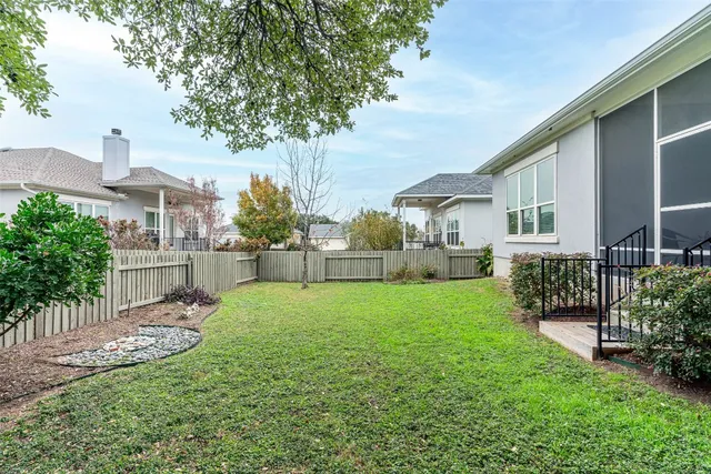 view of a brick house with a fountain in front of it