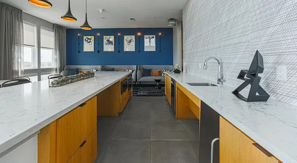 a kitchen with sink and stove