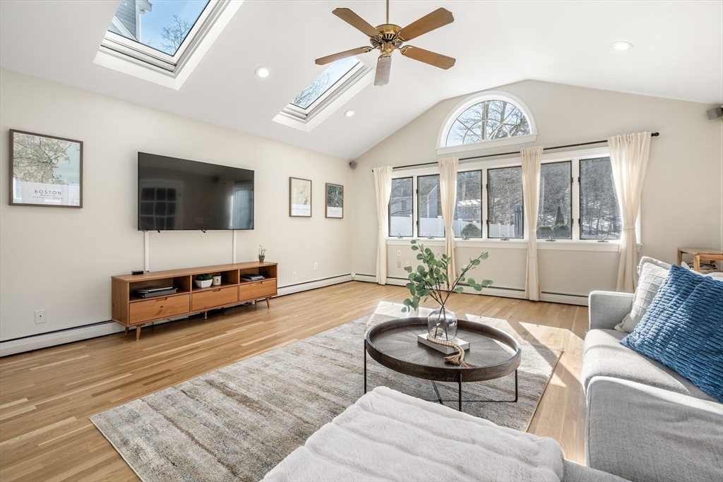 48 Spring Street Wakefield, MA 01880 - Photo 13 of 28 a living room with furniture and a flat screen tv