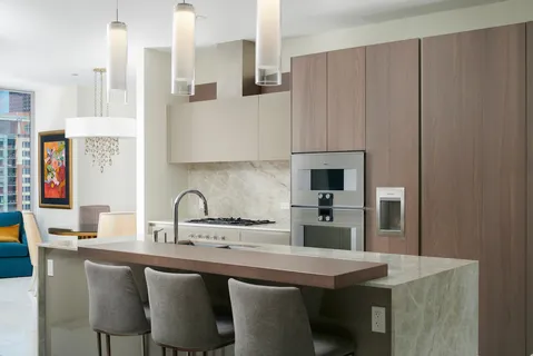 a kitchen with stainless steel appliances a sink and cabinets