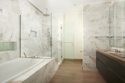 a bathroom with a bathtub and a sink