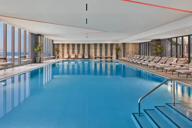 a view of a swimming pool with furniture