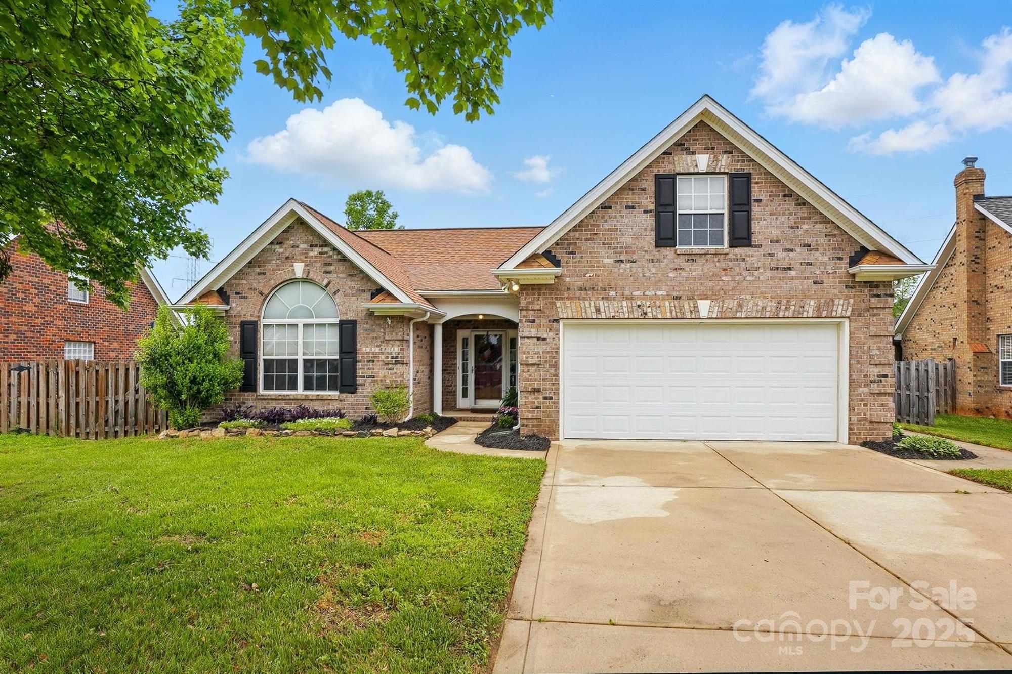 3327 Flagler Circle Midland, NC 28107 - Photo 2 of 45 a front view of a house with a yard and garage