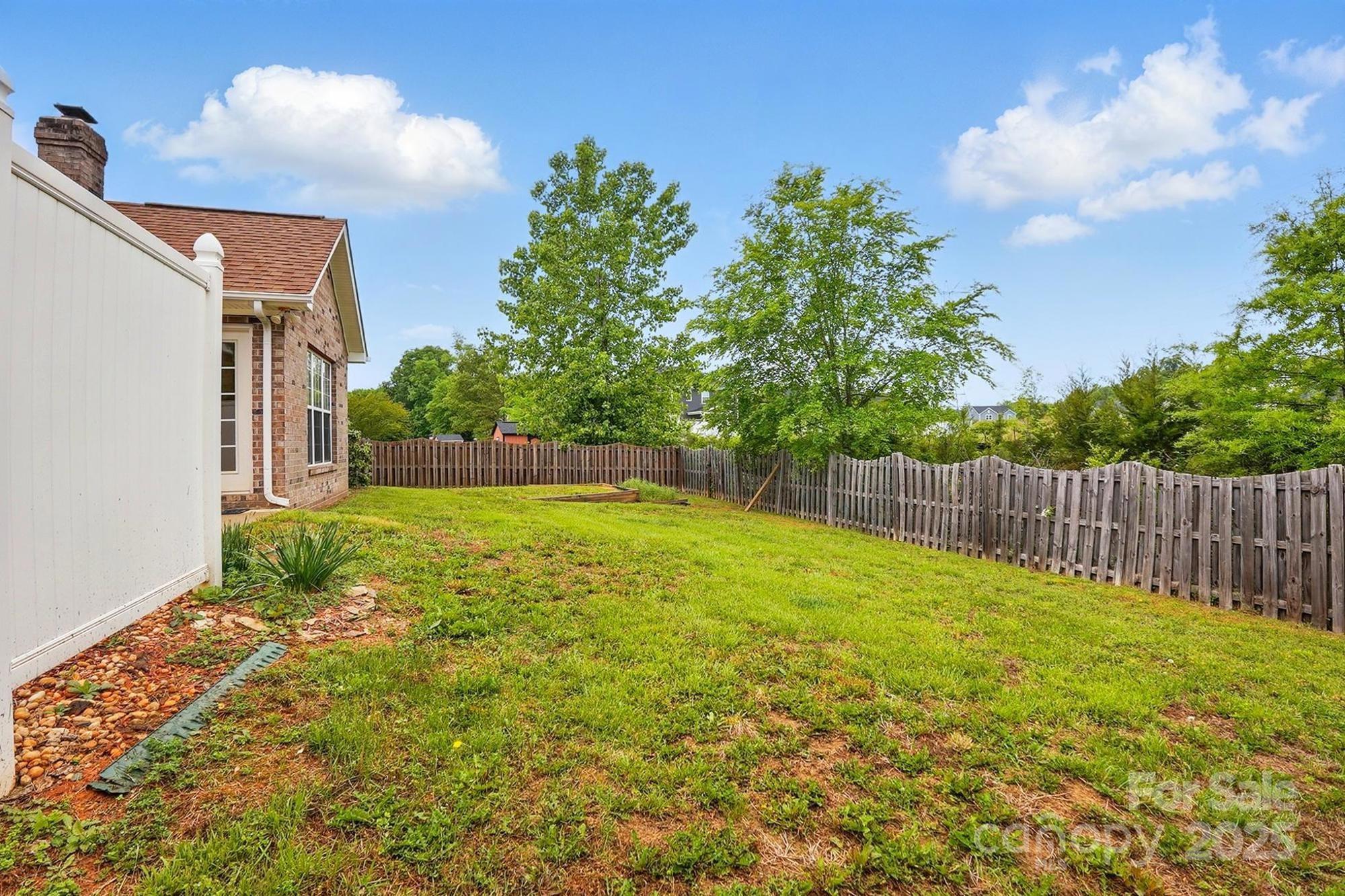 3327 Flagler Circle Midland, NC 28107 - Photo 41 of 45 a view of backyard with garden and trees