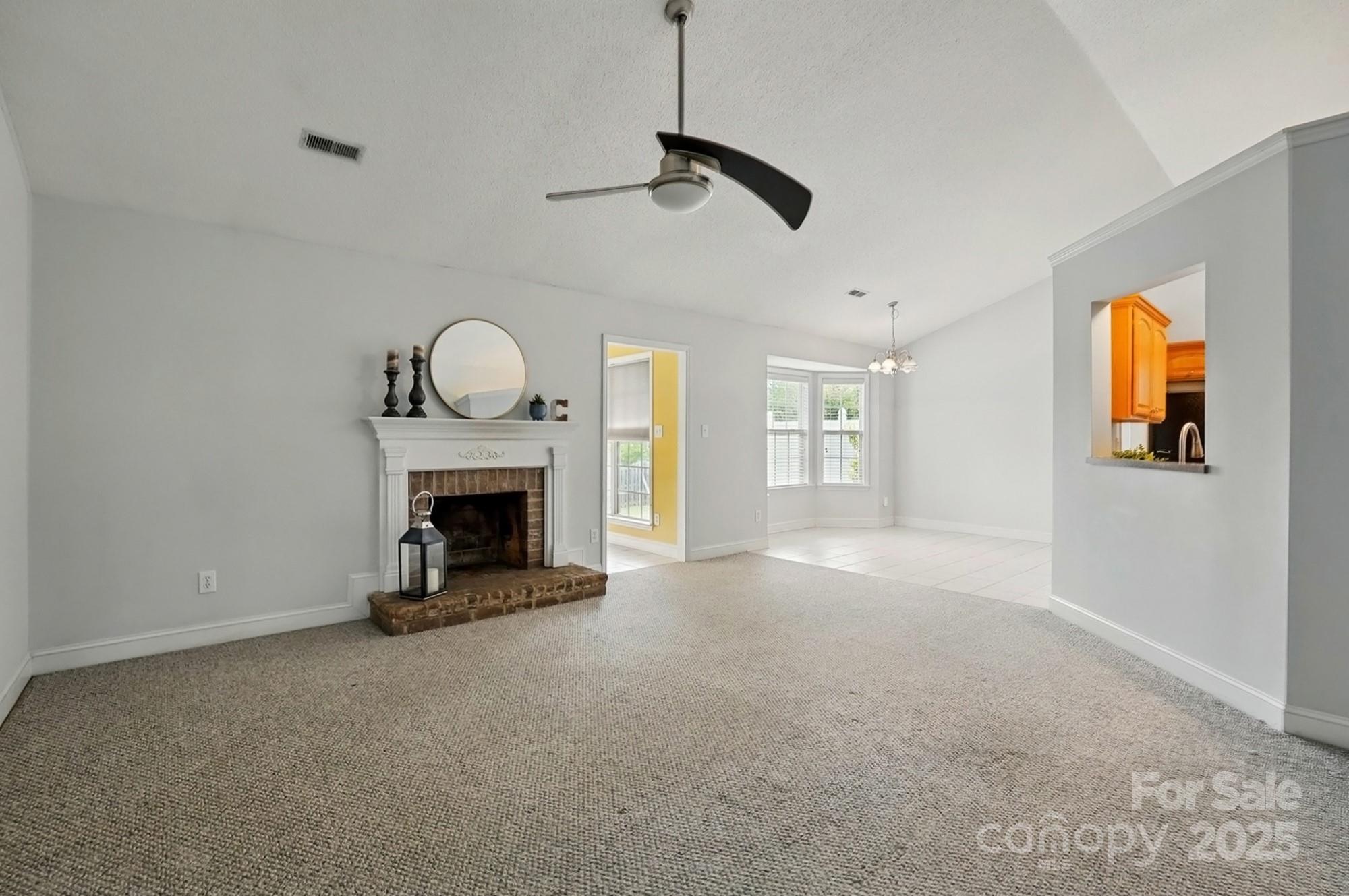 3327 Flagler Circle Midland, NC 28107 - Photo 9 of 45 a view of a livingroom with a fireplace and window