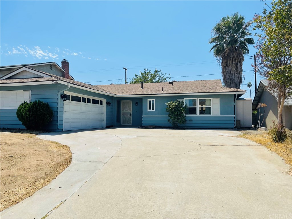 3596 Mapleleaf Drive Riverside, CA 92503 - Photo 1 of 1 a front view of a house with a yard