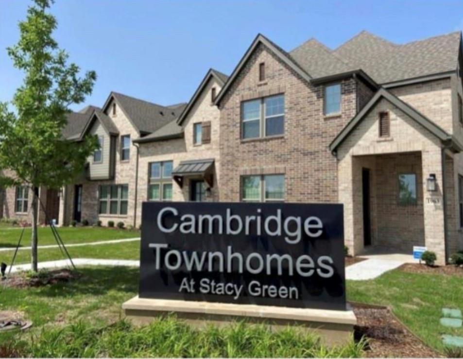 Community sign featuring a lawn