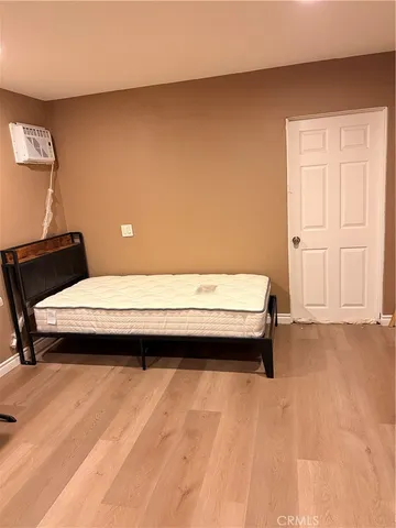 a bedroom with a bed and a chair