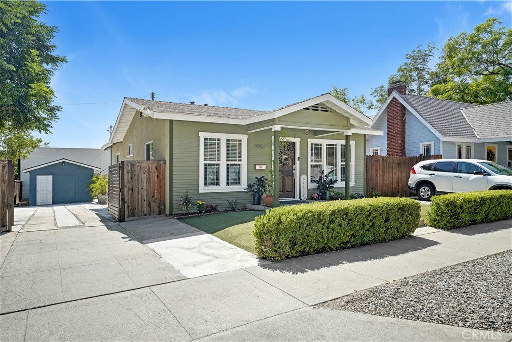 1982 Corson Street Pasadena, CA 91107 - Photo 2 of 30 a front view of a house with a yard and potted plants