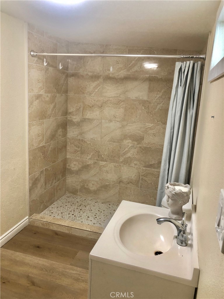 1982 Corson Street Pasadena, CA 91107 - Photo 21 of 30 a bathroom with a sink and a shower