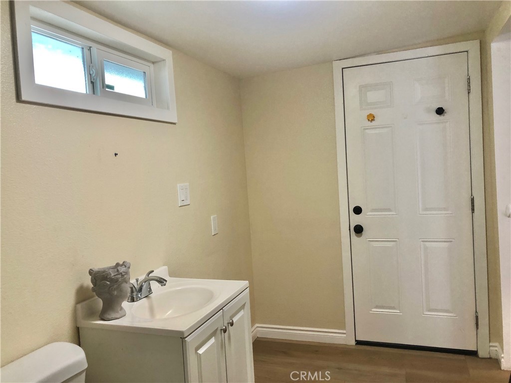 1982 Corson Street Pasadena, CA 91107 - Photo 25 of 30 a bathroom with a sink toilet and vanity
