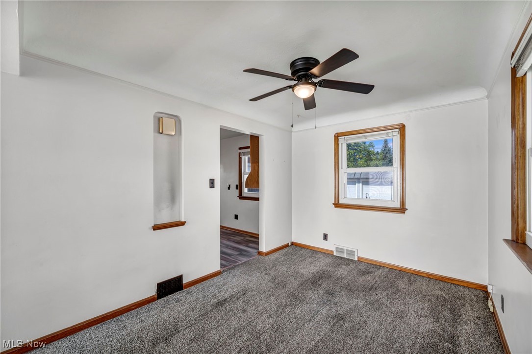 7822 Ridgefield Avenue Parma, OH 44129 - Photo 7 of 42 Carpeted spare room with baseboards and ceiling fan