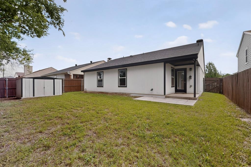7729 Misty Ridge Drive North Fort Worth, TX 76137 - Photo 30 of 30 a view of a house with backyard and garden