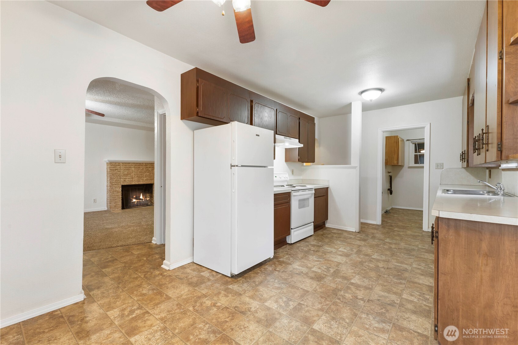 10114 Canyon Road East Tacoma, WA 98446 - Photo 11 of 31 a view of kitchen with furniture and refrigerator