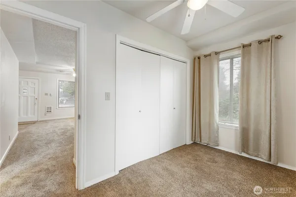 a bathroom with a bath tub with a shower
