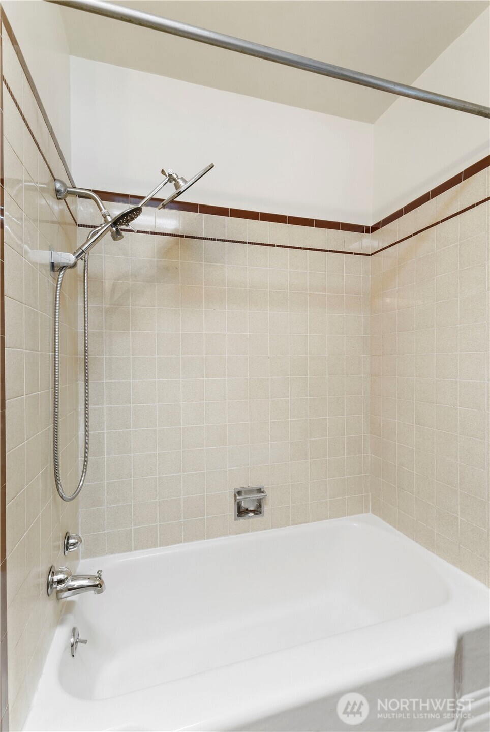10114 Canyon Road East Tacoma, WA 98446 - Photo 17 of 31 a bathroom with a bath tub with a shower