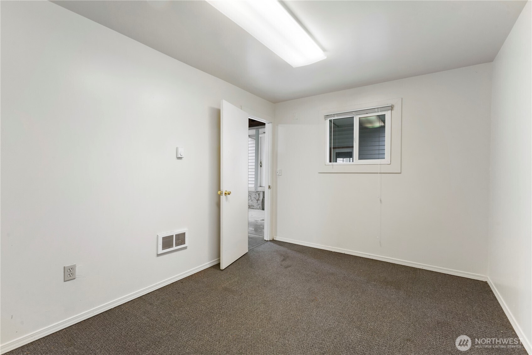 10114 Canyon Road East Tacoma, WA 98446 - Photo 26 of 31 an empty room with windows