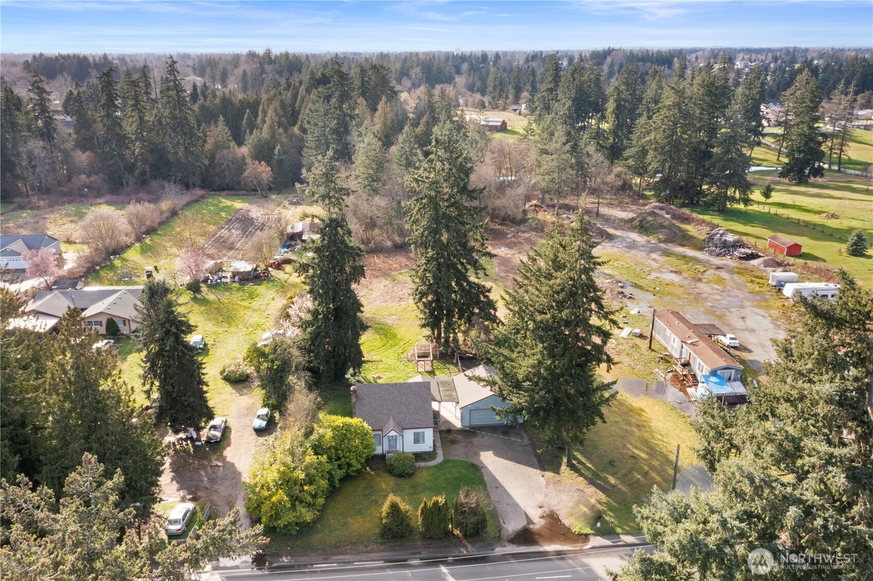 10114 Canyon Road East Tacoma, WA 98446 - Photo 27 of 31 a view of a yard with a tree