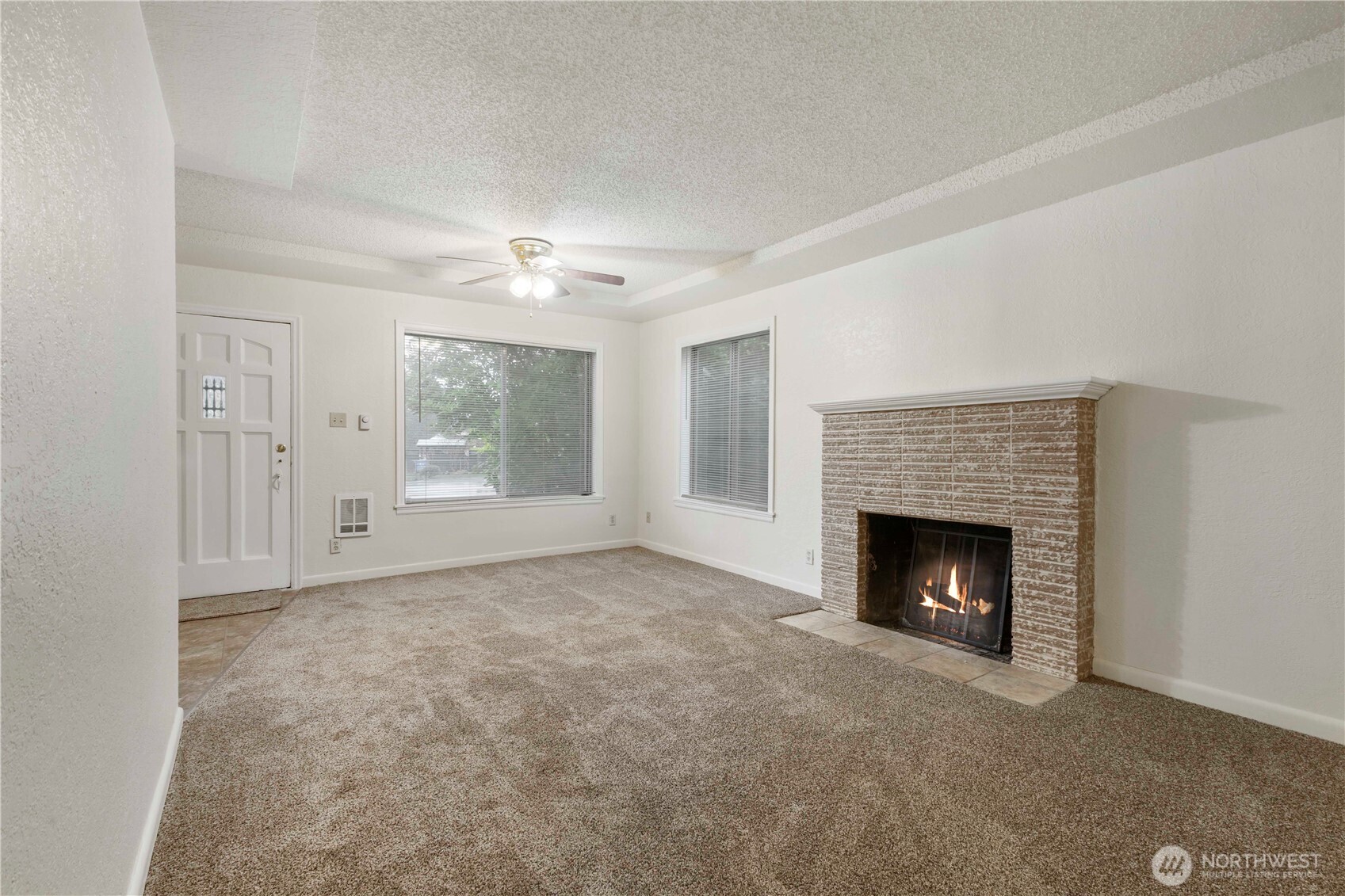 10114 Canyon Road East Tacoma, WA 98446 - Photo 5 of 31 a view of empty room with a fireplace