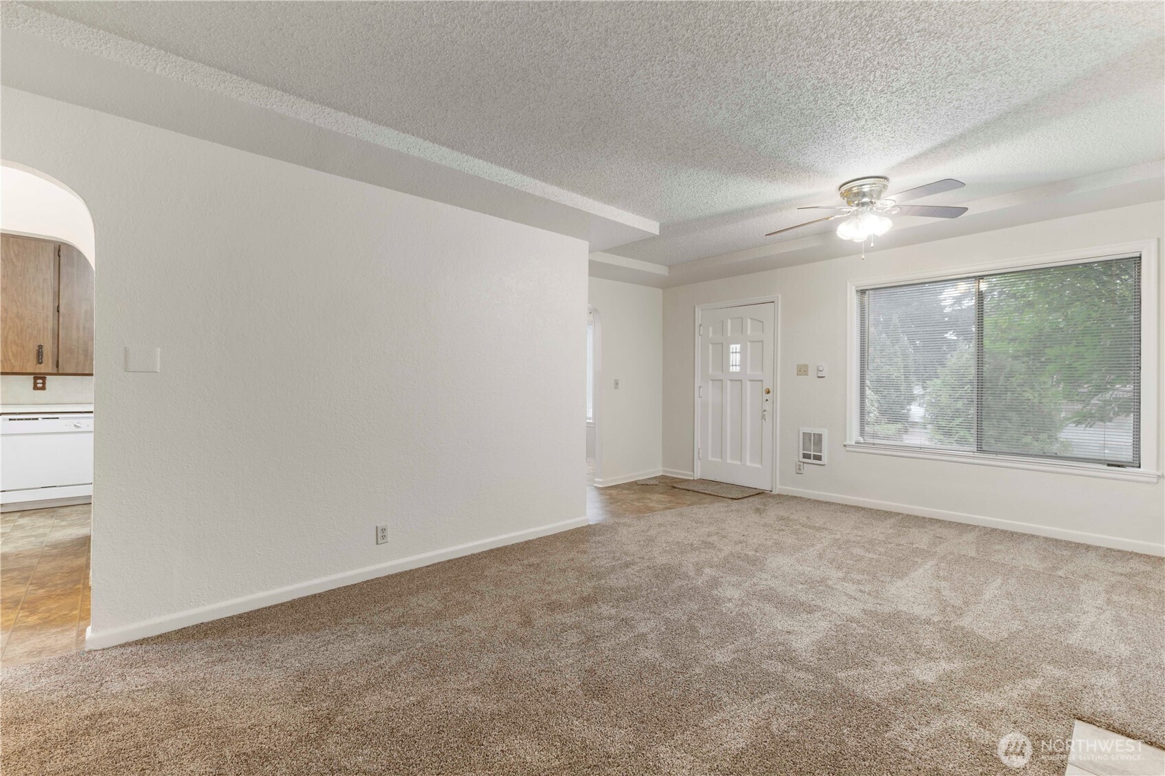 10114 Canyon Road East Tacoma, WA 98446 - Photo 6 of 31 an empty room with windows and fan