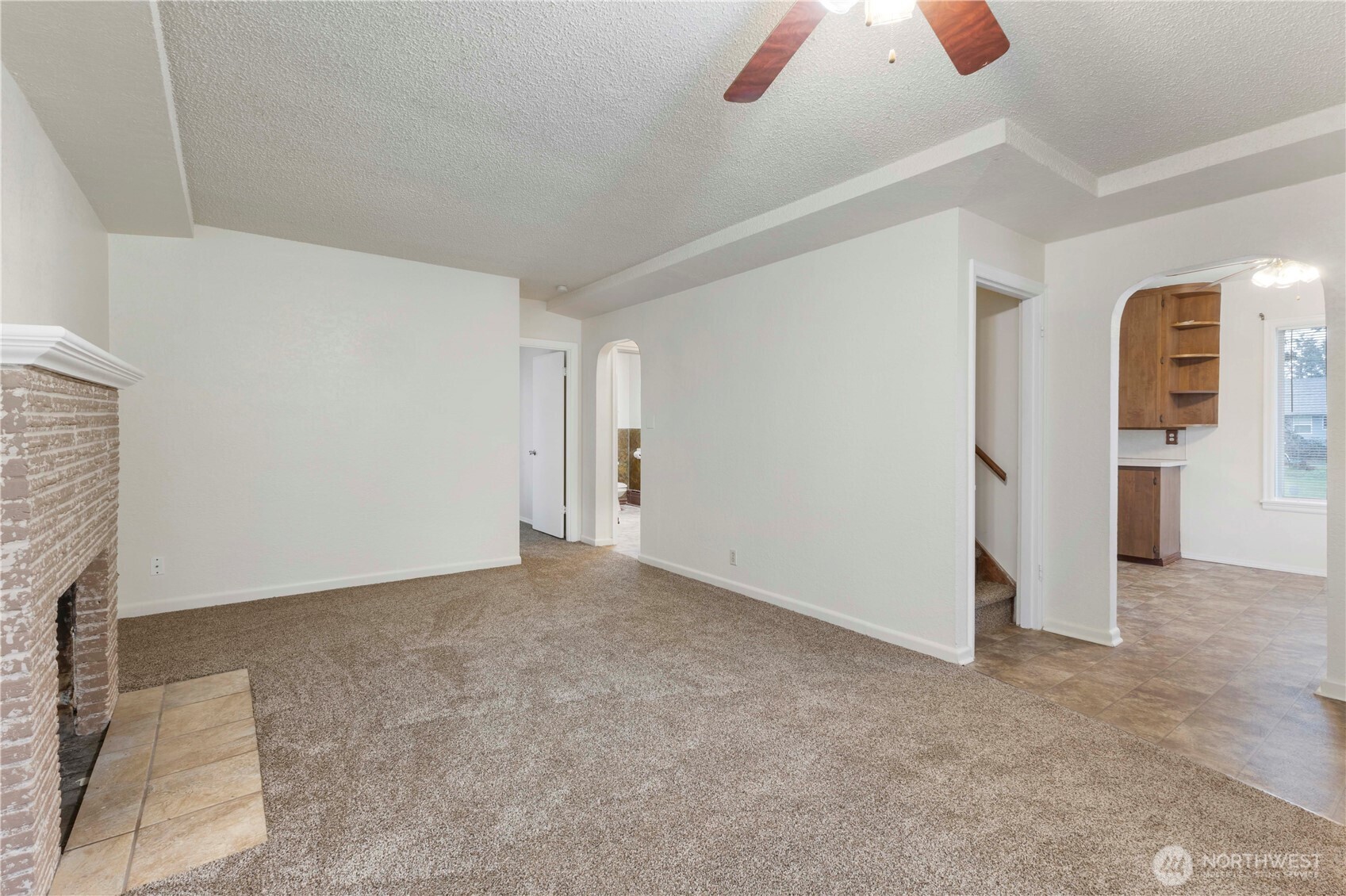 10114 Canyon Road East Tacoma, WA 98446 - Photo 7 of 31 a view of an empty room with a ceiling fan