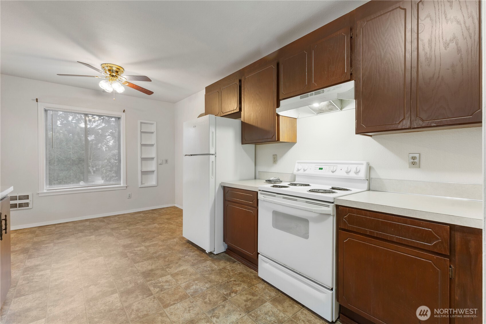 10114 Canyon Road East Tacoma, WA 98446 - Photo 10 of 31 a kitchen with a stove oven and sink