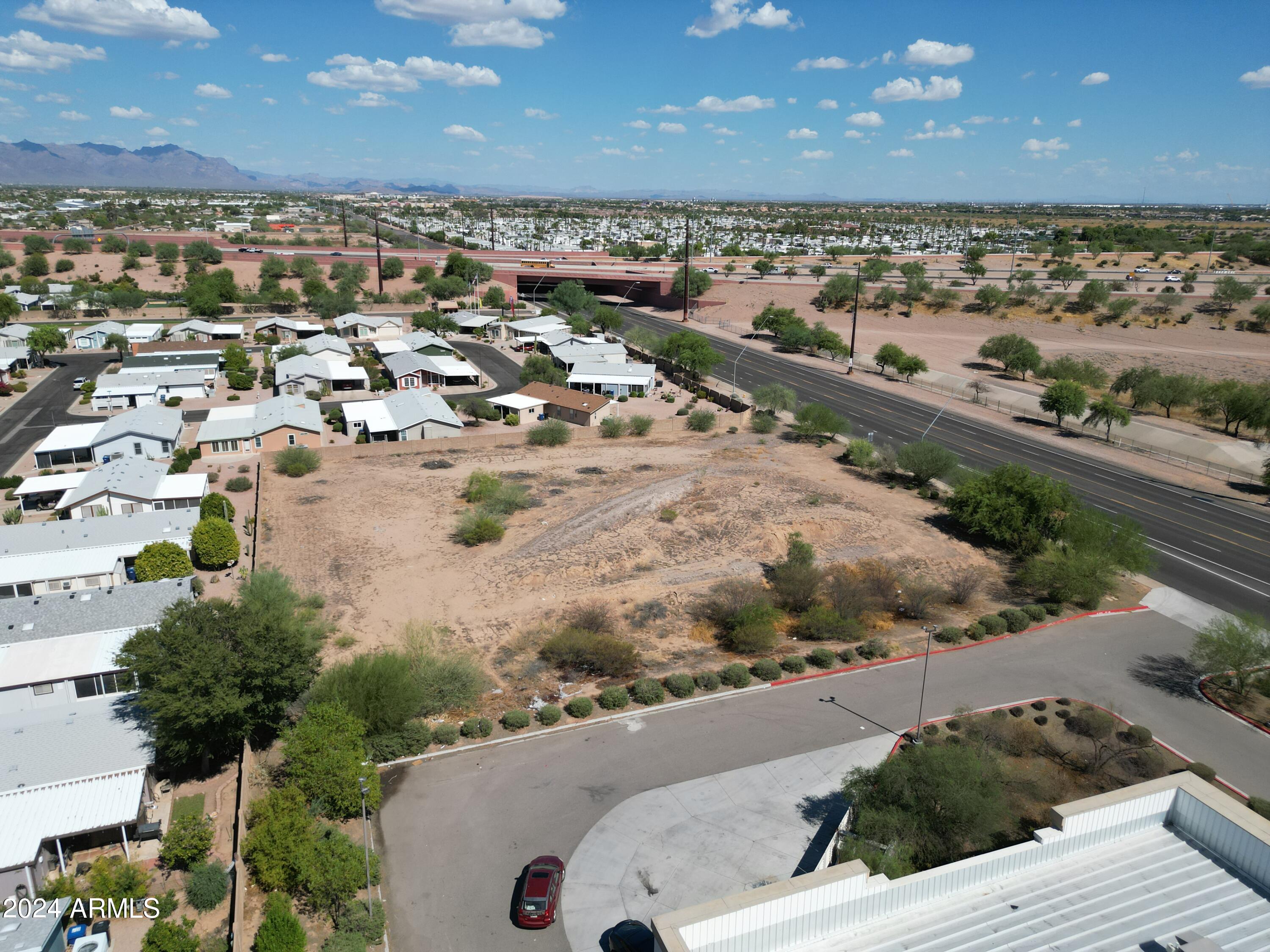 8442 East Southern Avenue, Unit 2 Mesa, AZ 85209 - Photo 13 of 15 an aerial view of residential houses with outdoor space